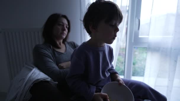 Little Boy Mother Lap Wearing Pajamas Holding Bowl Cereal Spoon — Stok video