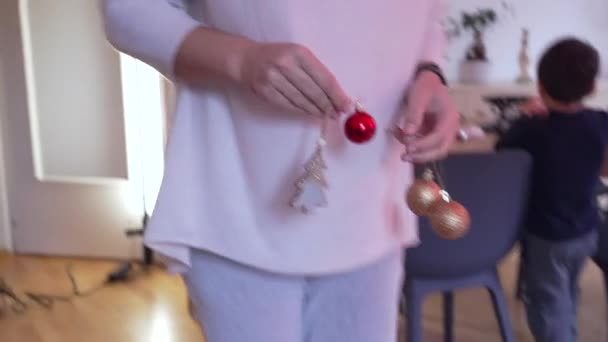 Person Preparing Holidays Adding Christmas Ball Ornament Tree Woman Close — Stock Video