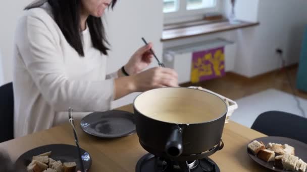 Swiss Fondue Feast Woman Enjoying Bread Cheese Home Homemade Traditional — Stock Video