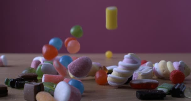 Sweetened Foam Sugar Candy Assortment Falling Table Super Slow Motion — Video