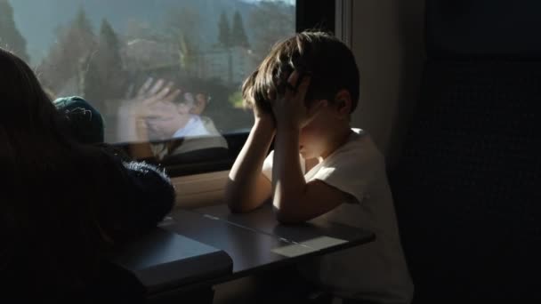 Tired Little Boy Rubbing Eyes Face While Moving Train Hiding — Wideo stockowe