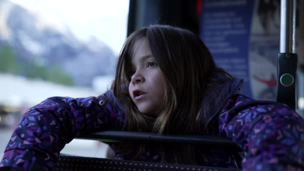 Pensive Little Girl Becoming Sad While Leaning Bus Seat Window — ストック動画