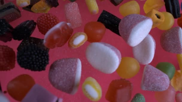 Macro Top View Colorful Candies Falling Super Slow Motion Pink — Stock Video