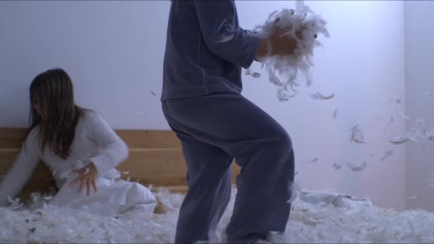 Pajama Pillow Battle Brother Tossing Handful Feathers Sister Slow Motion — Stock Video