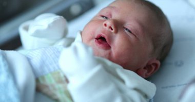 Newborn baby at hospital nursery after birth