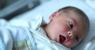 Newborn baby at hospital nursery after birth
