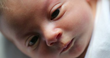 Newborn baby first day of life, close-up of face