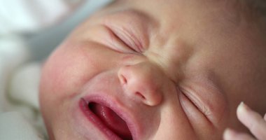 Cute newborn baby infant crying