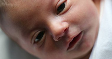 Closeup of infant newborn baby in first day of life