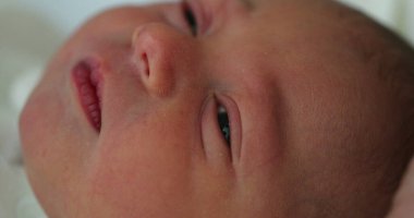 Newborn baby infant close-up during first day of life