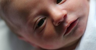Closeup of infant newborn baby in first day of life