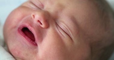 Cute newborn baby crying. adorable infant cries