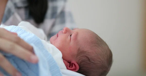 stock image Candid mom holding newborn baby at hospital