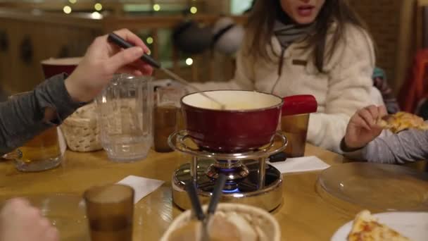 People Eating Cheese Fondue Restaurant Closeup Hand Dips Piece Bread — Stock Video