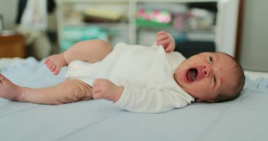 Infant newborn baby sleeping resting in bed