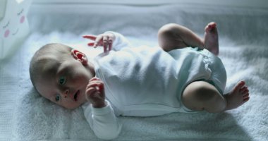 Baby newborn in first week of life seen from above