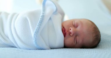 Beautiful newborn baby sleeping taking a nap
