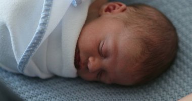 Newborn baby sleeping and resting during first week of life