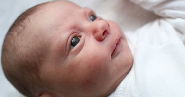 Cute newborn baby yawning during first days of life