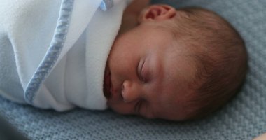 Newborn baby sleeping and resting during first week of life