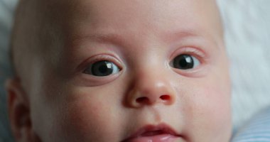 Baby newborn face closeup expression detail macro