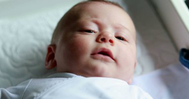 Baby infant portrait face looking