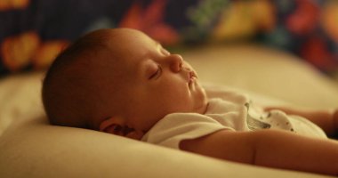 Baby newborn sleeping at night in bedtime