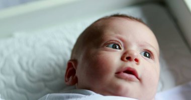 Baby infant portrait face looking