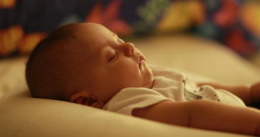 Baby newborn sleeping at night in bedtime