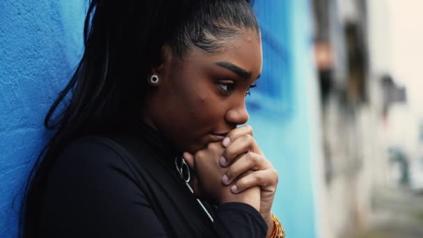 One Pensive Young Black Woman Pondering Decision Hands Clenched Together — Stock Video