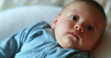 Cute baby portrait face looking to camera
