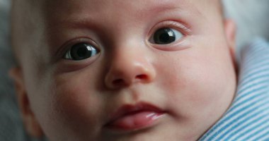 Healthy Baby portrait newborn face closeup during first months of life