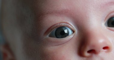 Macro baby newborn eyes closeup