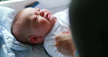 Mom clothing upset baby infant