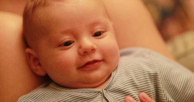 Infant smiling and laugh face expression