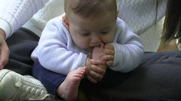 Baby putting foot in mouth infant puts feet in mouth