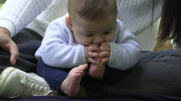 Baby putting foot in mouth infant puts feet in mouth
