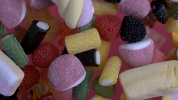 Variety Candy Thrown Camera Macro Top View Super Slow Motion — Stock Video