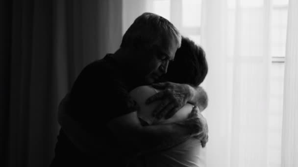 Elderly Husband Comforting Depressed Wife Dramatic Window Scene Senior Couple — Stock Video