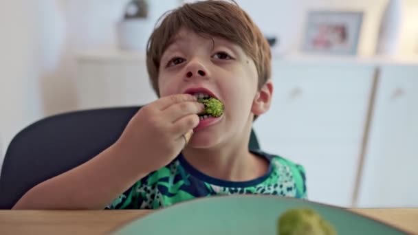 Little Boy Eating Broccoli Hands Sporting Kids Bandage — Stock Video