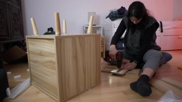 Woman Assembling Furniture Home Drilling Machine Person Moving New Home — Stock Video