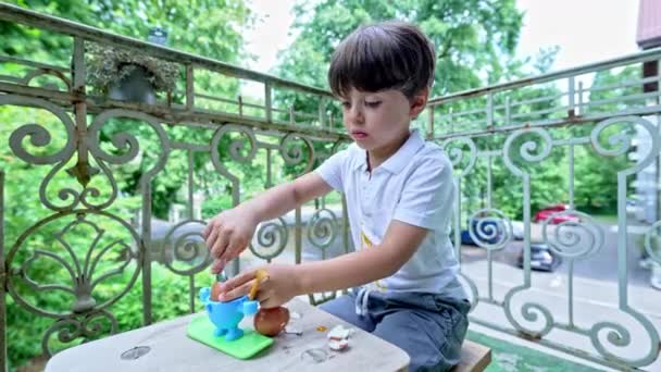 Little Boy Delights Soft Yolk Boiled Egg Seated Balcony Child — Stok Video