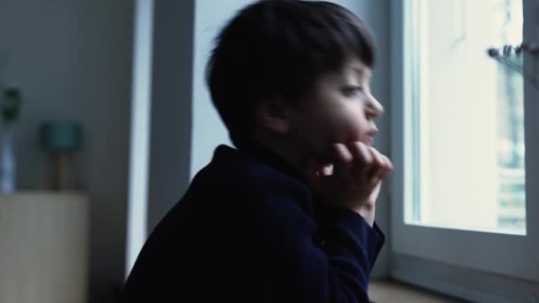 Thoughtful Bored Child Standing Home Hand Chin Observing View Apartment — Stock Video