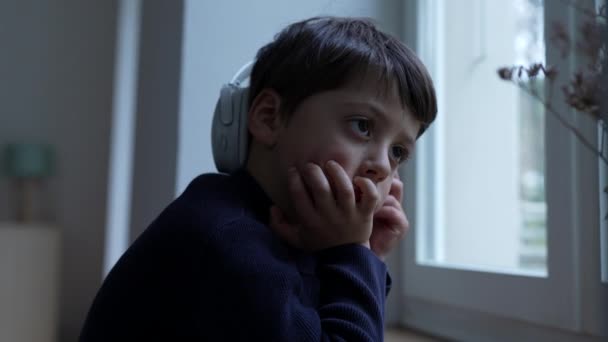 Thoughtful Small Boy Hand Chin Daydreaming Home Window Pensive Child — Stock Video