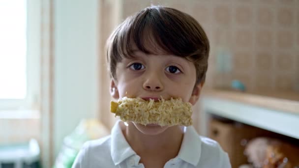 Little Boy Facing Camera Holding Devoured Cooked Corn Cob His — Stock Video