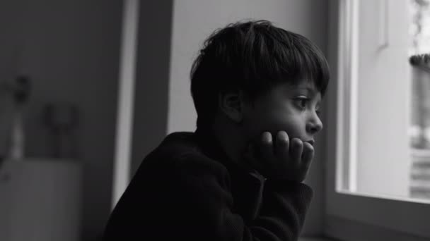 Depressed Child Stands Window Gazing View Introspective Sad Expression Moody — Stock Video