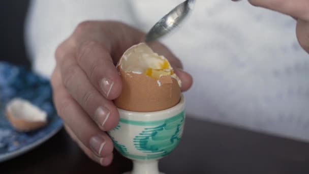 Close Hand Eating Soft Boiled Egg Cracked Top Protein Rich — Stock Video
