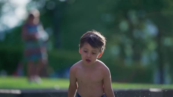 Joyful Child Splashing Water Upwards Super Slow Motion Hot Summer — Stock Video