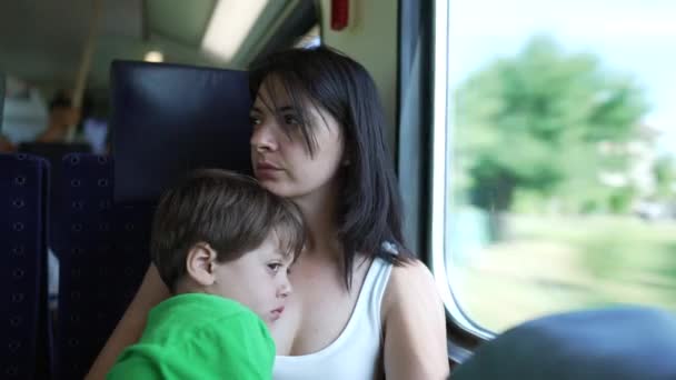 Mother Child Traveling Train Pensive Mom Lost Thought Seated High — Stock Video