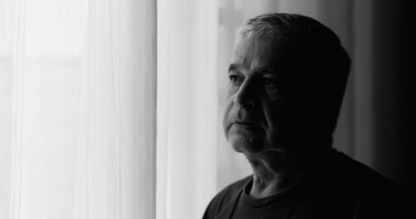 Pensive Melancholic Senior Man Stands Curtain Window Dramatic Black White — Stock video